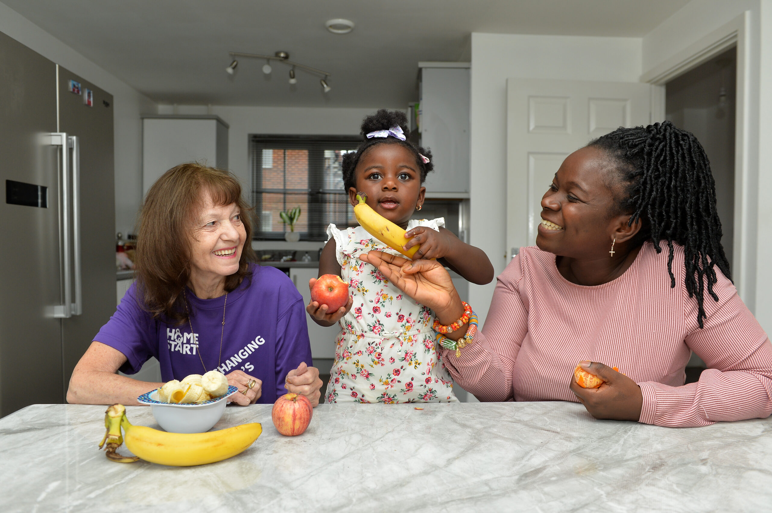 Home-Start volunteer with mum and baby